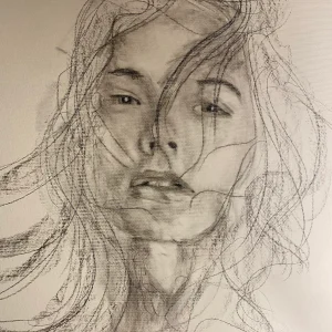 Portret žene radjen ugljenom na papiru